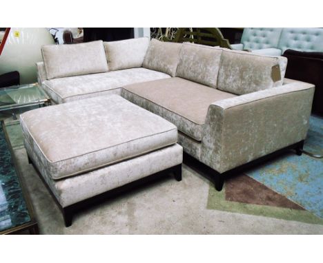 CORNER SOFA, in light cream velvet upholstery with wooden plinth and matching footstool, 160cm x 245cm x 70cm. (2)