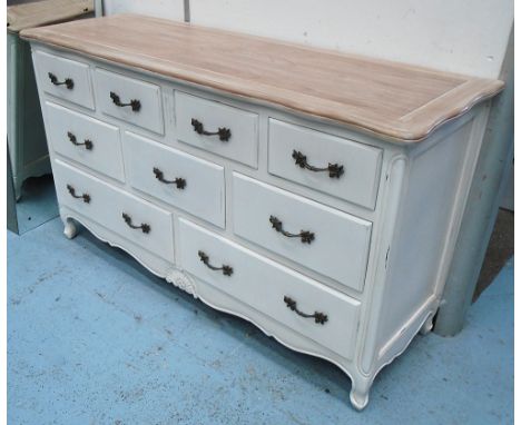 LONG COMMODE, French style having a shaped bleached top above nine drawers with metallic handles and shaped apron, 150cm L x 
