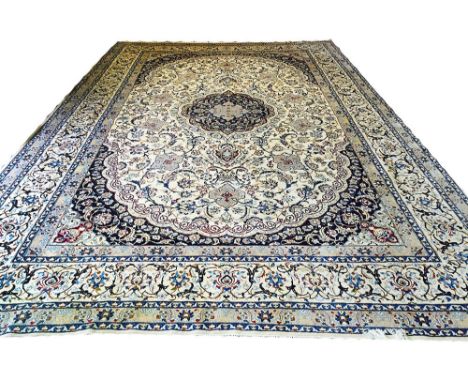 FINE LARGE PART SILK NAIN CARPET, 537cm x 342cm, central medallion on a palmette and vine ivory field within midnight blue sp