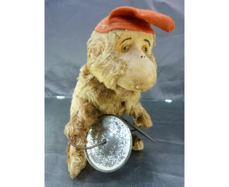 Mid-20th Century clockwork automaton toy monkey playing the Cymbals.