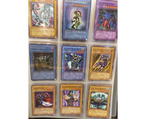Collection of Kazuki Takahashi playing cards in folder