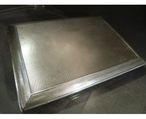 Hallmarked silver cigarette case with silver Gilt interior. Hallmarked for London 1939 by S J Rose & Son. Engine turned decor