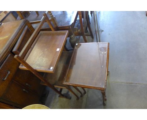 An oak two tier folding table/firescreen and a mahogany nest of tables