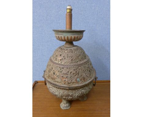 An eastern copper table lamp