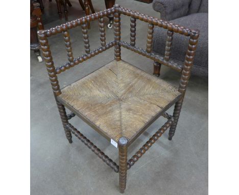 A Victorian beech bobbin turned corner chair