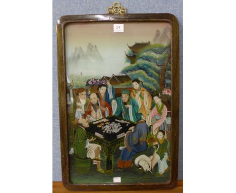 A Chinese reverse oil painting on glass, figures playing mah jong, framed