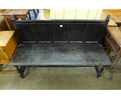 An ebonised bench