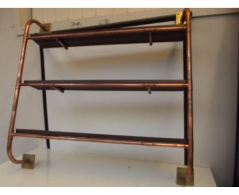 Wall mounting industrial style shelf fashioned from reclaimed wood and copper piping 