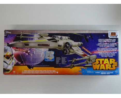 A large scale STAR WARS X-Wing fighter model by HASBRO