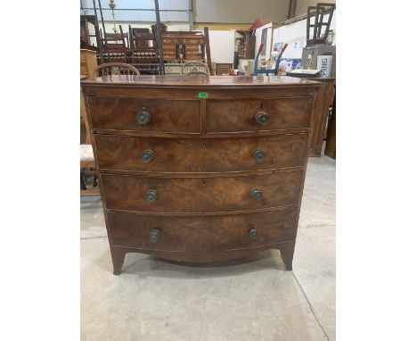 A Regency mahogany bowfronted chest, the two short over three long drawers with patera handles, on splayed bracket feet. 40' 