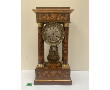 A French rosewood and marquetry portico mantle clock, the drum movement rack striking on a bell, the silvered dial with Roman