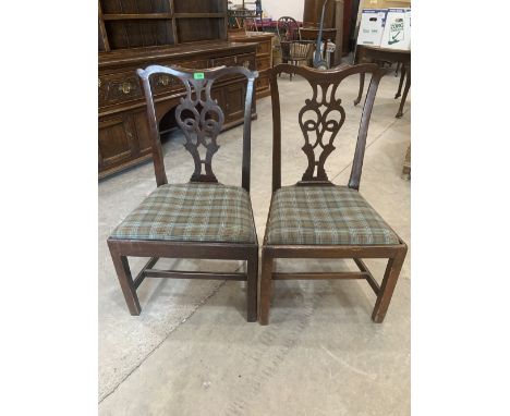 A pair of mahogany Chippendale style dining chairs with pierced splats