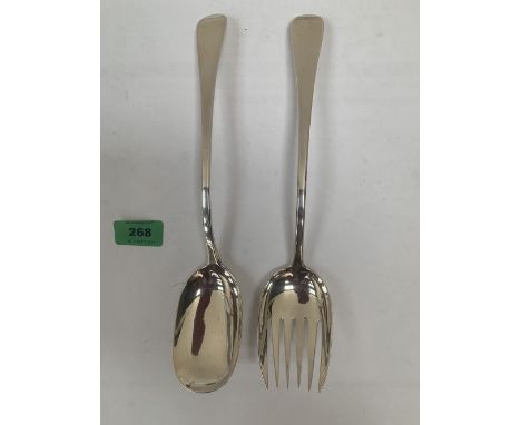 A George III silver serving spoon and fork. London 1805 and 1806. 11' long. 7ozs 6dwts