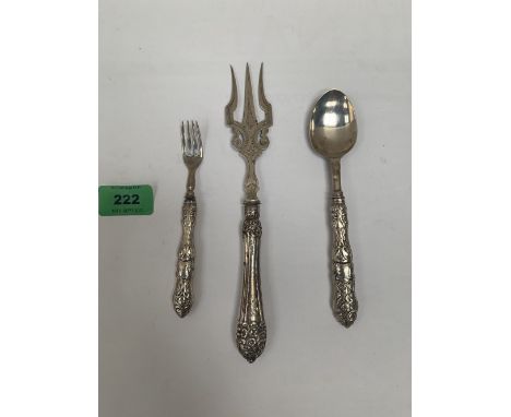 A silver fish fork; a silver spoon and a silver cake fork. (3) Handles loaded