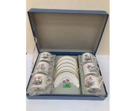 A boxed Royal Worcester set of six coffee cans and saucers
