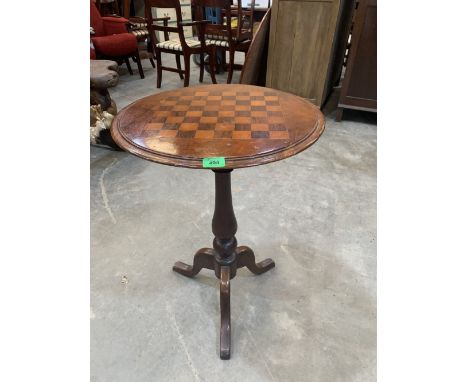 A Victorian walnut tripod occasional table with chessboard top