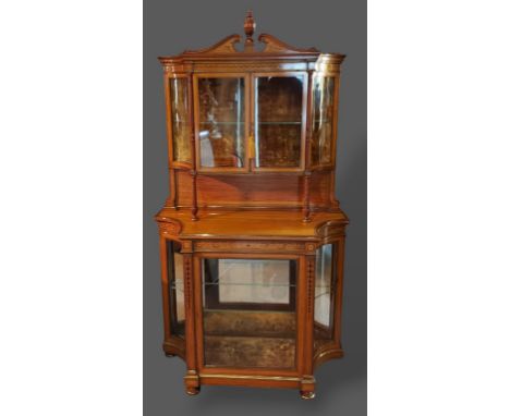An Edwardian Sheraton revival marquetry inlaid and gilt metal mounted cabinet, the swan neck pediment with central finial abo