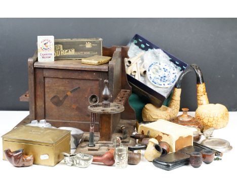 Box of smoking and tobacco paraphernalia to include decorative wooden pipe box, pipe stands, various ashtrays, clay and novel