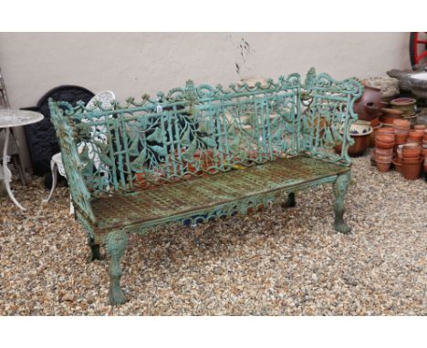 Cast iron ornate gothic pattern garden bench with weathered patina, 100cm high, 177cm wide, 48cm deep