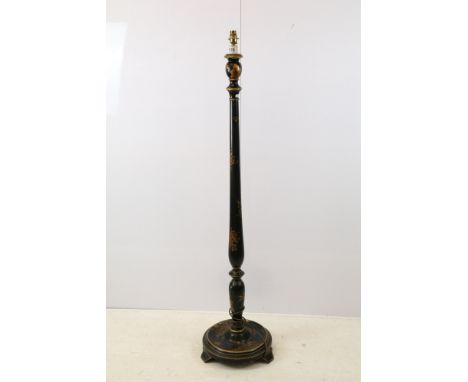 Chinoiserie standard lamp, with turned column, the black lacquered ground with gilded decoration, raised on three feet, 144cm