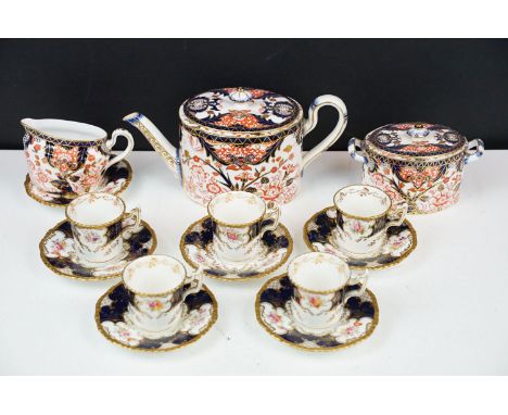Royal Crown Derby oval teapot, milk jug and lidded sugar basin decorated in the Imari pallete with 5 Coalport small coffee cu