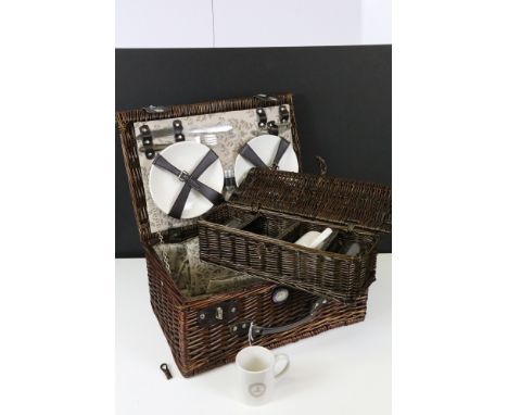 Mercedes Benz picnic hamper mounted with Mercedes Benz enamel badge, with contents comprising: two plates, two knives, two fo