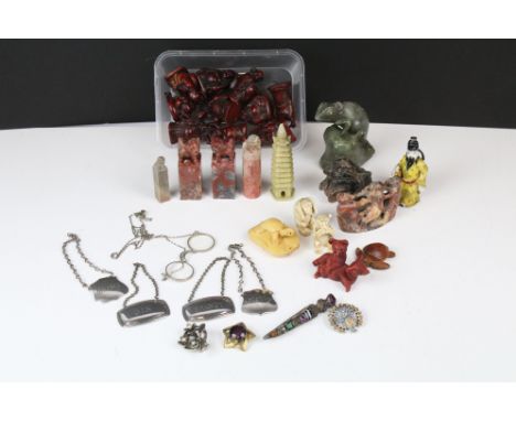 A group of mixed oriental collectables to include Netsuke, carved soapstone figures and seals, together with a selection of c
