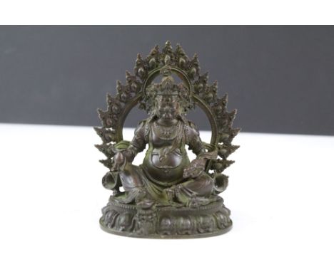 Cast bronze Hindu deity figure raised on a lotus base. Measures 11cm. 