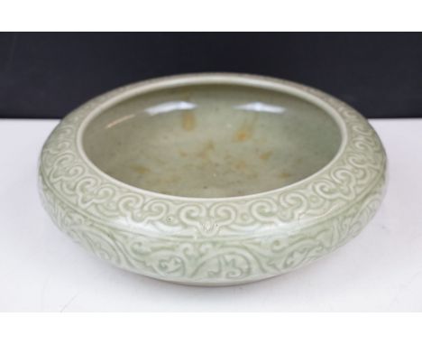 Chinese celadon shallow bowl, in the Longquan style, with stylised design, impressed character seal to underside, 8cm high x 