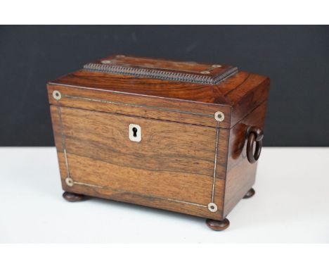 Early 19th century sarcophagus shaped tea caddy with shell inlay detail, ruched velvet lining, button feet, complete with key