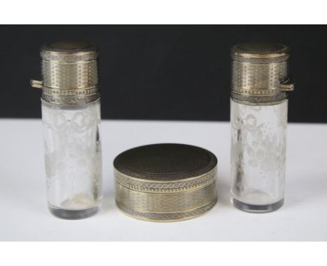 19th Century French silver dressing table items to include two cylindrical glass bodied scent bottles with silver engine turn