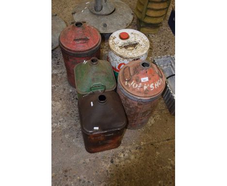 Six vintage oil cans