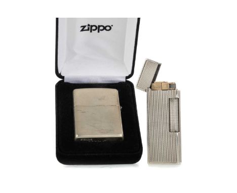 DUNHILL SILVER ENGINE TURNED CIGARETTE LIGHTER, along with a Zippo lighter, marked Sterling, boxedQty: 2Dunhill is assayed st