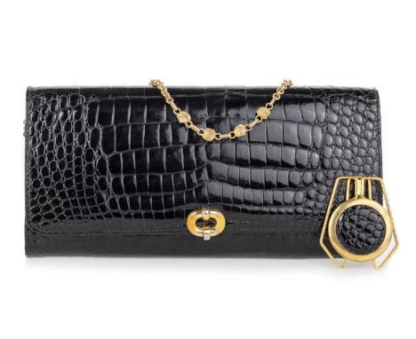 BABY CROCODILE SKIN CLUTCH BAG, along with a money clip, set with baby crocodile medallion22.5cm wide 