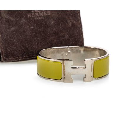 HERMES OF PARIS, CLIC CLACK H BRACELET, with olive enamel surrounding the 'H' monogram, in original dust jacket, unboxedCondi
