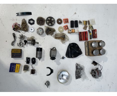 A selection of mostly Vincent Sparesincluding pistons, kickstart cover, dynamo, valves, electrical components, a sealed Lucas