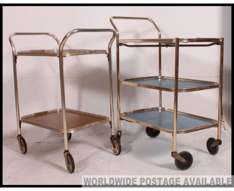 2 vintage mid century retro hostess trolleys, one in blue, the other faux wood. Each having twin trays that remove