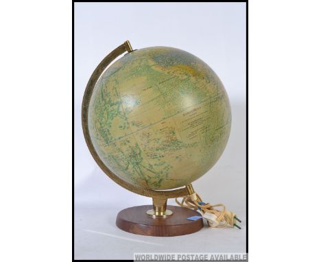 A retro 1970's Danish made Scan Globe terrestrial illuminated globe, supported by a brass gibb on a circular base.