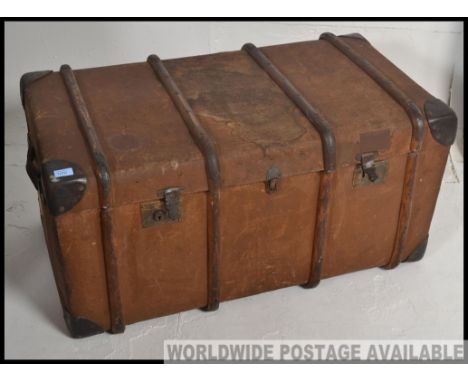 A good quality large early 20th century wooden and canvas bound steamer trunk. Of large proportions with hinged top and clasp