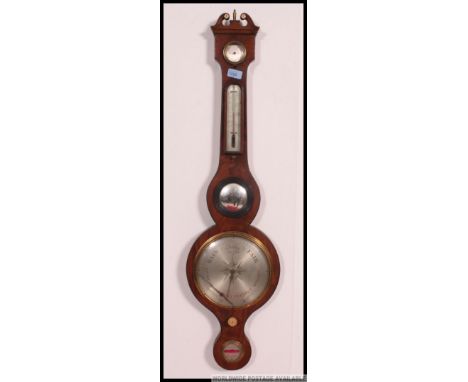A 19th century mahogany mercury banjo wall barometer with silvered dial and thermometer with hydrometer. Finished with swan n