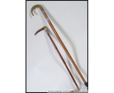 A silver collared horn cane riding crop along with a silver collared horn handled walking stick 88cm and 68cm