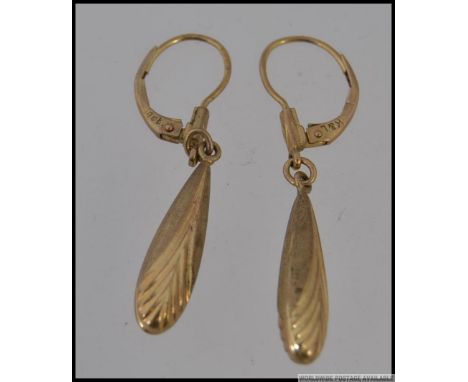 A pair of 9ct gold drop earrings with Art Deco chevron decoration. Marked 9ct  K&L. Weight 1.9g