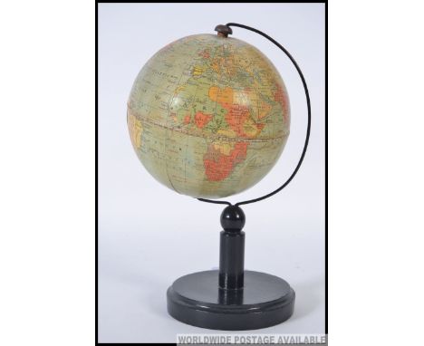 An English 6 inch terrestrial table globe on wooden stand, Philips, London, 1930`s, the sphere applied with twelve coloured g