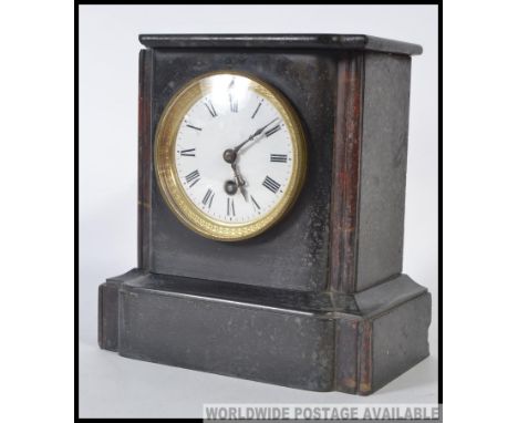 A Victorian mahogany slate mantel clock having decorative dial with 8 day movement ( brass ) set within