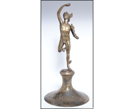 A cast pewter figure of Eros raised on a hand beaten bell shaped socle stamped to the base Hutton Sheffield English Pewter 04