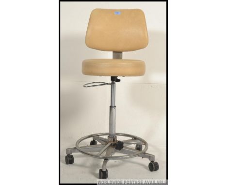 A vintage retro Murray Equipment Co, 1970's retro tubular chrome industrial / medicine / dental chair having vinyl upholstery