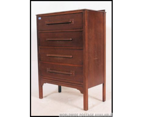A 20th 1930's century retro  / vintage  Art Deco oak chest of drawers having a straight 4 configuration with original handles