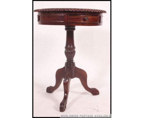 A contemporary hardwood drum / side tripod table. The top with drawers having turned column with splayed legs Measures: 78 x 