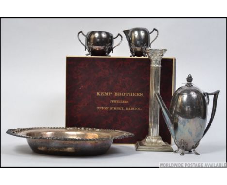 A mid 20th century silver plated coffee service to include coffee pot, creamer and sugar bowl by LS Co made in US America alo