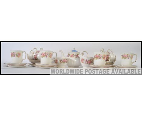 A Colcough vintage chintz pattern part tea service together with a matching pattern service Colclough coffee mug set etc 